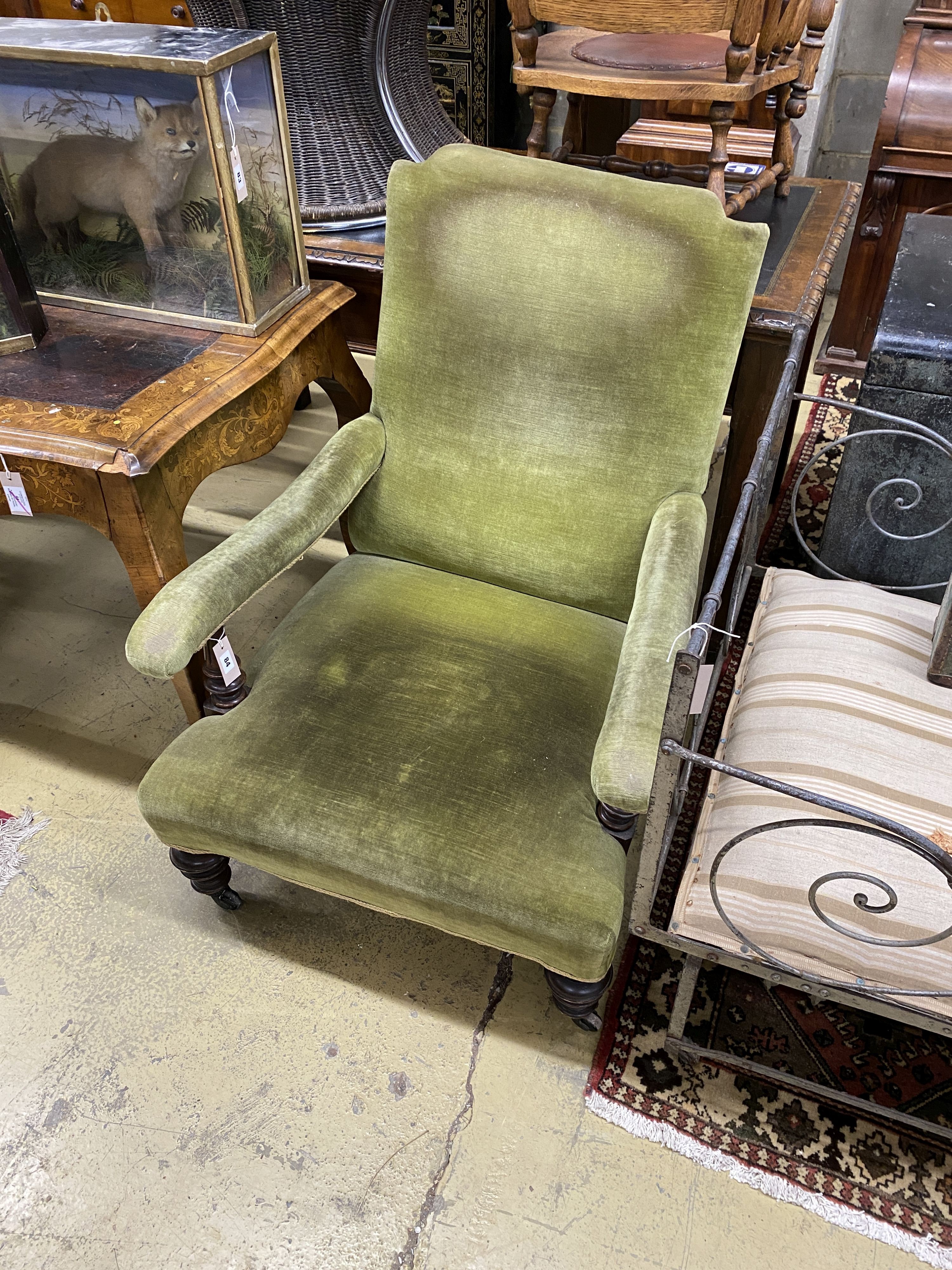 A late Victorian Howard style upholstered open armchair, width 74cm, depth 88cm, height 92cm